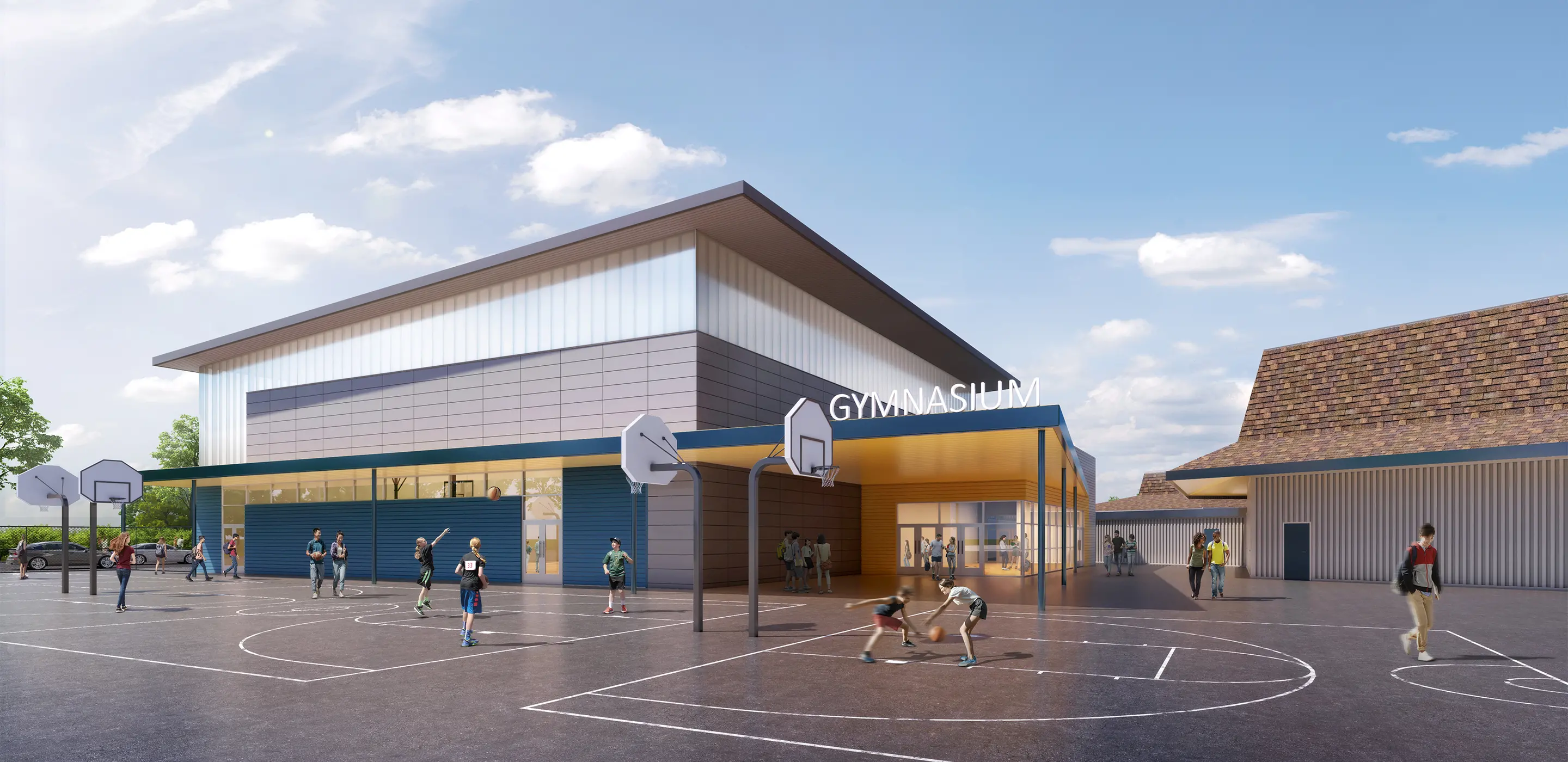 Modern gymnasium exterior with people playing basketball and walking. Bright day with a clear blue sky.