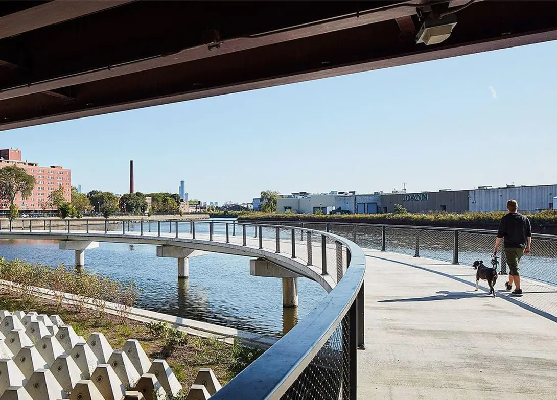 image of bridge over river at housing complex