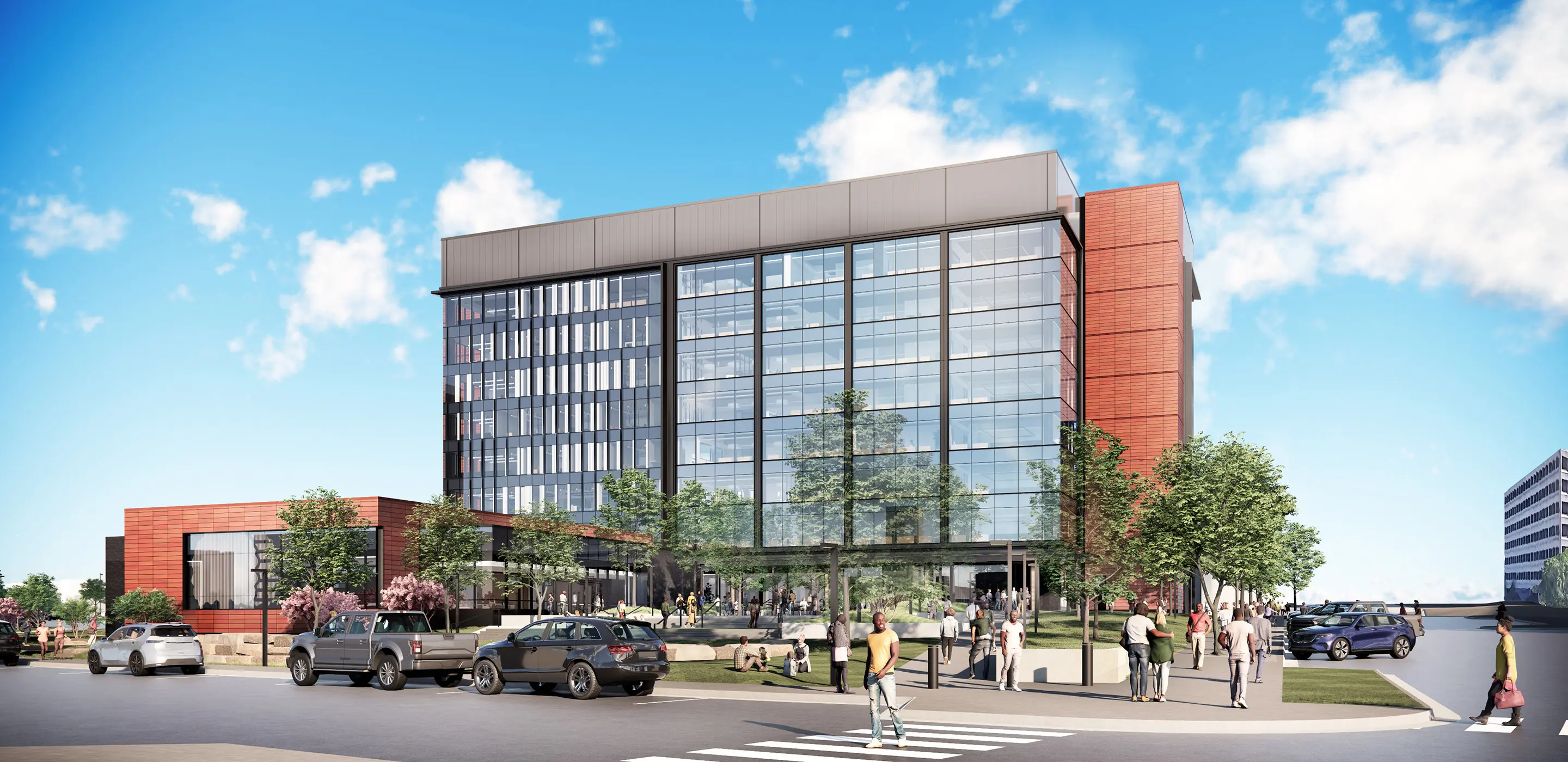 Modern office building with glass facade, people walking, cars parked, and trees in foreground, under blue sky.
