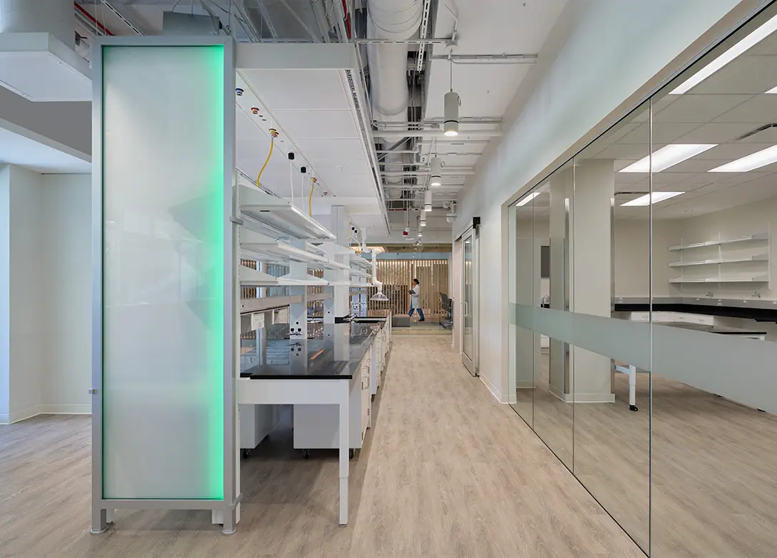 Modern laboratory interior with sleek design, glass walls, and state-of-the-art equipment.