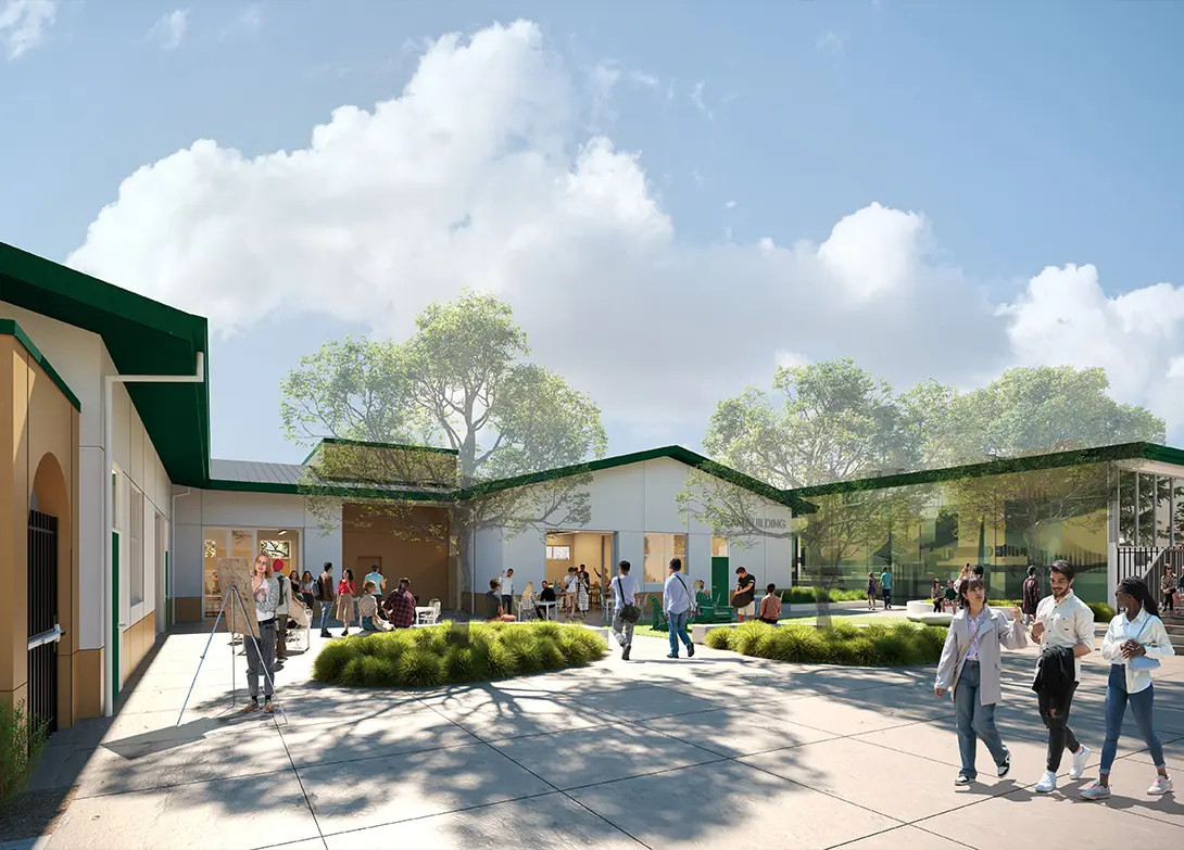 Modern school campus courtyard with students socializing and trees under a clear blue sky.