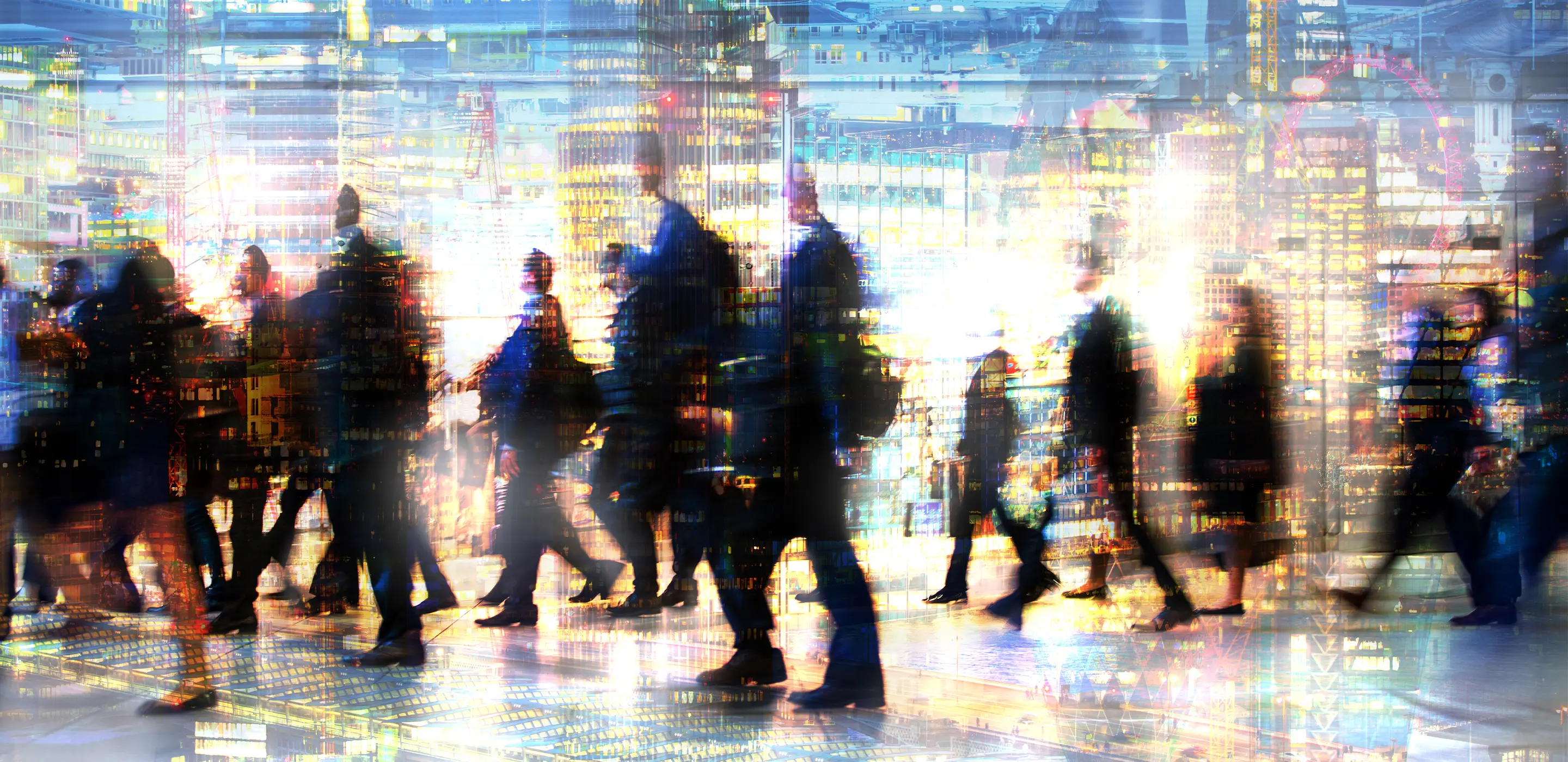 Blurred commuters walking in a vibrant cityscape, evoking a sense of bustling urban life.