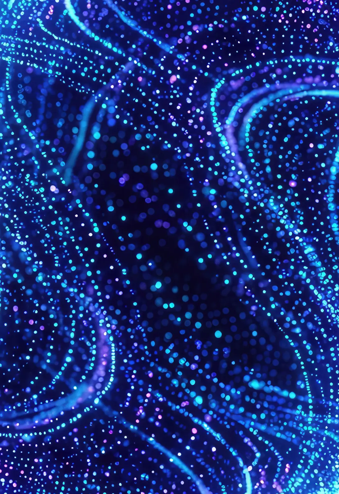 Abstract glowing blue and purple light trails, representing digital data or futuristic technology background.